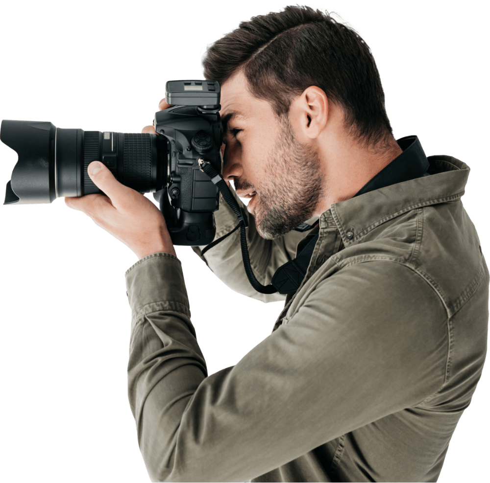Fotograf podczas pracy z aparatem